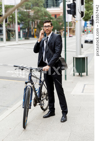 Young businessmen with a bike Young businessmen with a bike 33867442