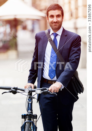 Young businessmen with a bike Young businessmen with a bike 33867896