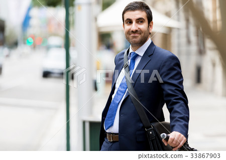 Young businessmen with a bike Young businessmen with a bike 33867903