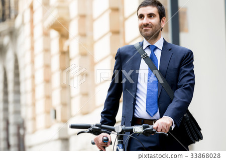 Young businessmen with a bike Young businessmen with a bike 33868028