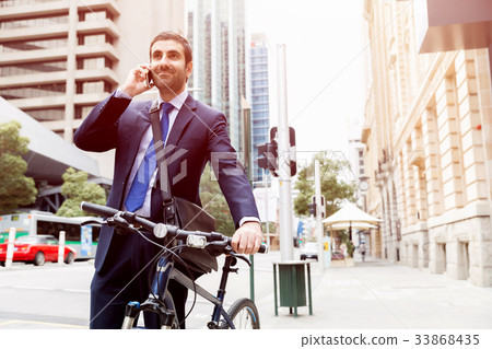 Young businessmen with a bike Young businessmen with a bike 33868435