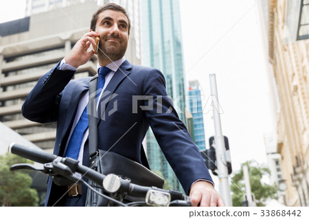 Young businessmen with a bike 33868442