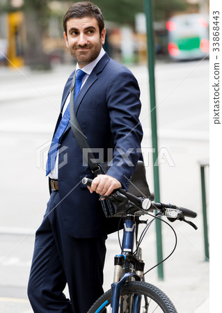 Young businessmen with a bike Young businessmen with a bike 33868443