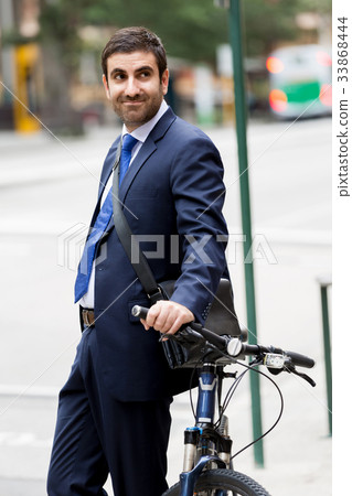 Young businessmen with a bike 33868444