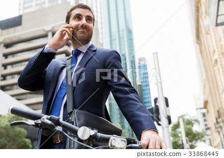 Young businessmen with a bike 33868445