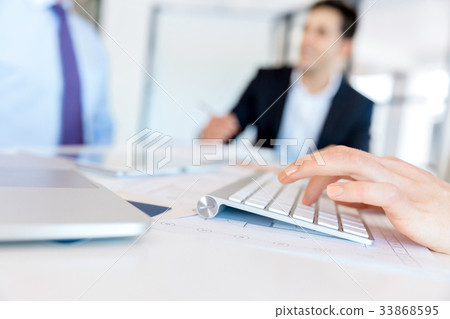 Image of woman's hands typing 33868595