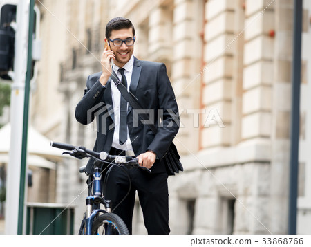 Young businessmen with a bike Young businessmen with a bike 33868766