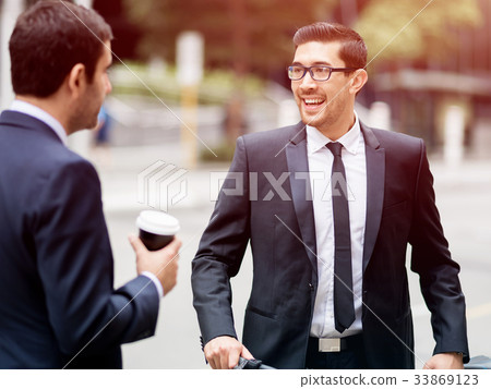Two businessmen talking outdoors 33869123