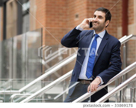 Portrait of handsome businessman outdoor 33869178
