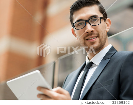Portrait of handsome businessman outdoor Portrait of handsome businessman outdoor 33869362