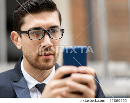 Portrait of handsome businessman outdoor 33869363