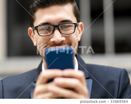 Portrait of handsome businessman outdoor 33869364