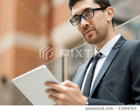 Portrait of handsome businessman outdoor Portrait of handsome businessman outdoor 33869365