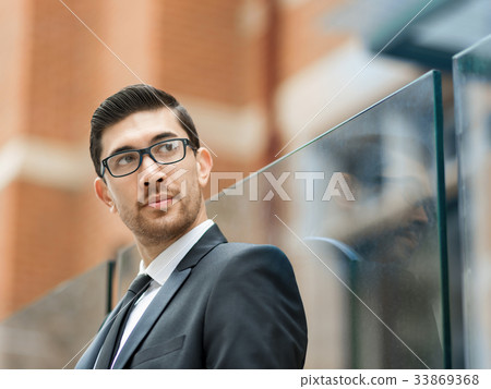 Portrait of handsome businessman outdoor 33869368