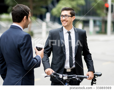 Young businessmen with a bike Young businessmen with a bike 33869369