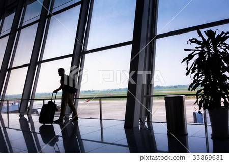 Passengers tourist standing with luggage Passengers tourist standing with luggage 33869681