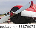three airplane on the field 33870073