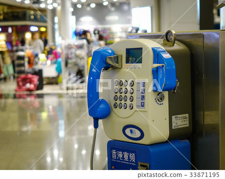 Public fixed telephone booth at the airport Public fixed telephone booth at the airport 33871195