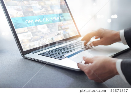 businessman holding credit card using laptop businessman holding credit card using laptop 33871857