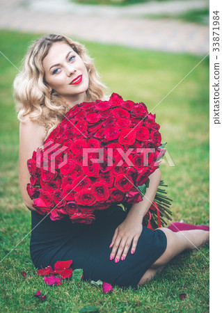 Elegant beautiful blonde woman is wearing black Elegant beautiful blonde woman is wearing black 33871984