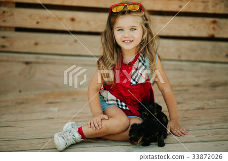 Happy smiling child girl is wearing fashion 33872026