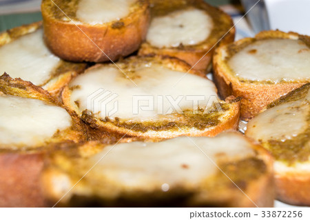 Toasted bread with olive paste and cheese Toasted bread with olive paste and cheese 33872256