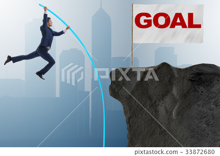 Businessman pole vaulting towards his success goal 33872680