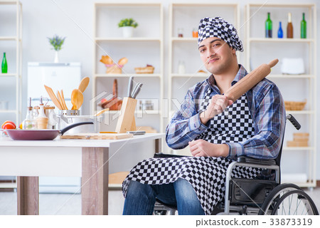 Young cook with roller preparing dough meal 33873319