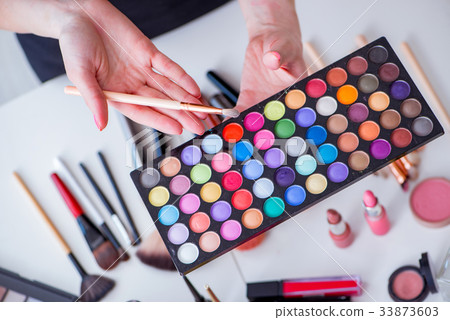 Collection of make up products displayed on the Collection of make up products displayed on the 33873603