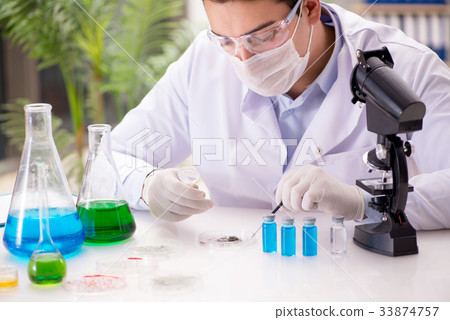 Male doctor working in the lab on virus vaccine 33874757