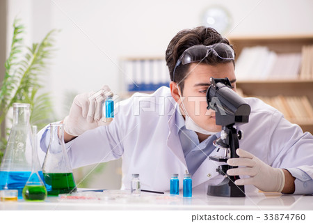 Male doctor working in the lab on virus vaccine 33874760