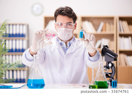 Male doctor working in the lab on virus vaccine 33874761