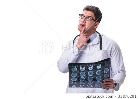 Young male doctor holding a radiograph isolated on Young male doctor holding a radiograph isolated on 33876291