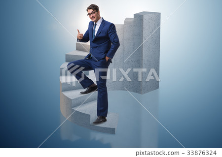 Businessman climbing career ladder in business Businessman climbing career ladder in business 33876324