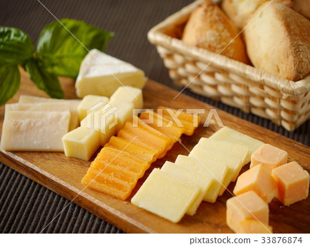 Variety cheese and scones on wooden board (horizontal position) 33876874