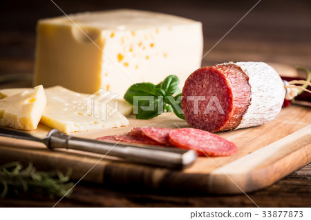 Dry salami or sausage with cheese Dry salami or sausage with cheese 33877873
