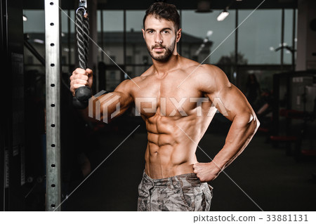 Caucasian sexy fitness model in gym close up abs. Caucasian sexy fitness model in gym close up abs. 33881131
