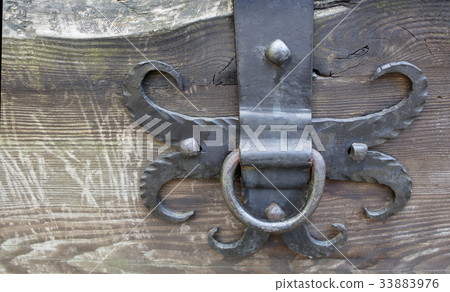 An ancient iron forged horse ring used by Cossacks An ancient iron forged horse ring used by Cossacks 33883976