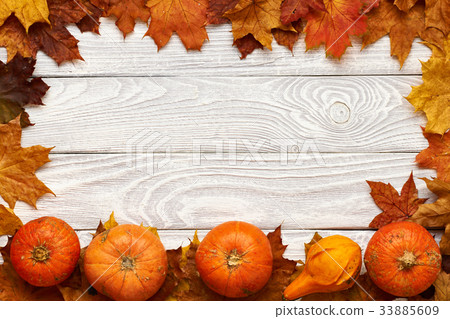 Autumn leaves and pumpkins  33885609