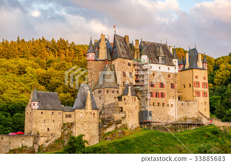Burg Eltz castle in Rhineland-Palatinate at sunset Burg Eltz castle in Rhineland-Palatinate at sunset 33885683