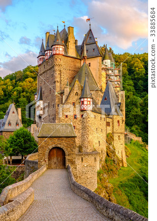 Burg Eltz castle in Rhineland-Palatinate at sunset Burg Eltz castle in Rhineland-Palatinate at sunset 33885684