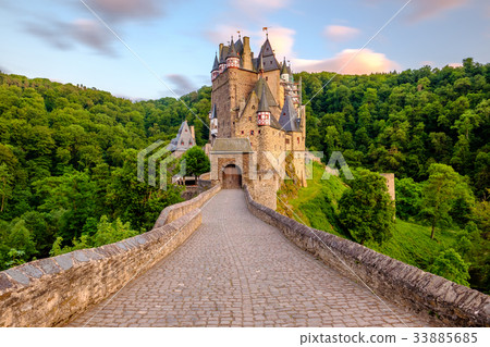 Burg Eltz castle in Rhineland-Palatinate at sunset Burg Eltz castle in Rhineland-Palatinate at sunset 33885685