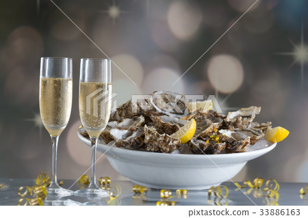 Fresh oysters with glass of champaigne 33886163