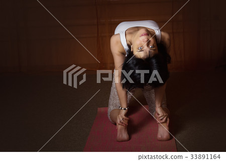 Caucasian woman in asana doing yoga exercise 33891164