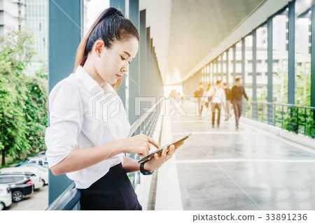 Asian business  Using smartphone 33891236