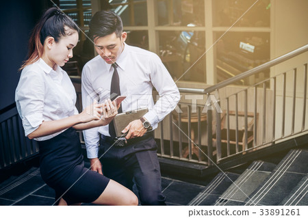Business man and woman Using smartphone  33891261