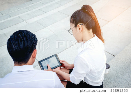 Business people meeting and using digital tablet Business people meeting and using digital tablet 33891263