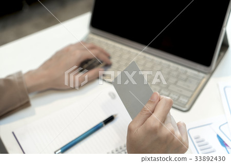 Credit card in female hand Credit card in female hand 33892430