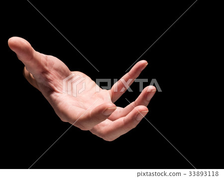 Male hand on a black background. 33893118