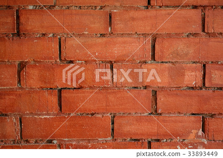 Grunge old cracked ochre brick wall background 33893449
